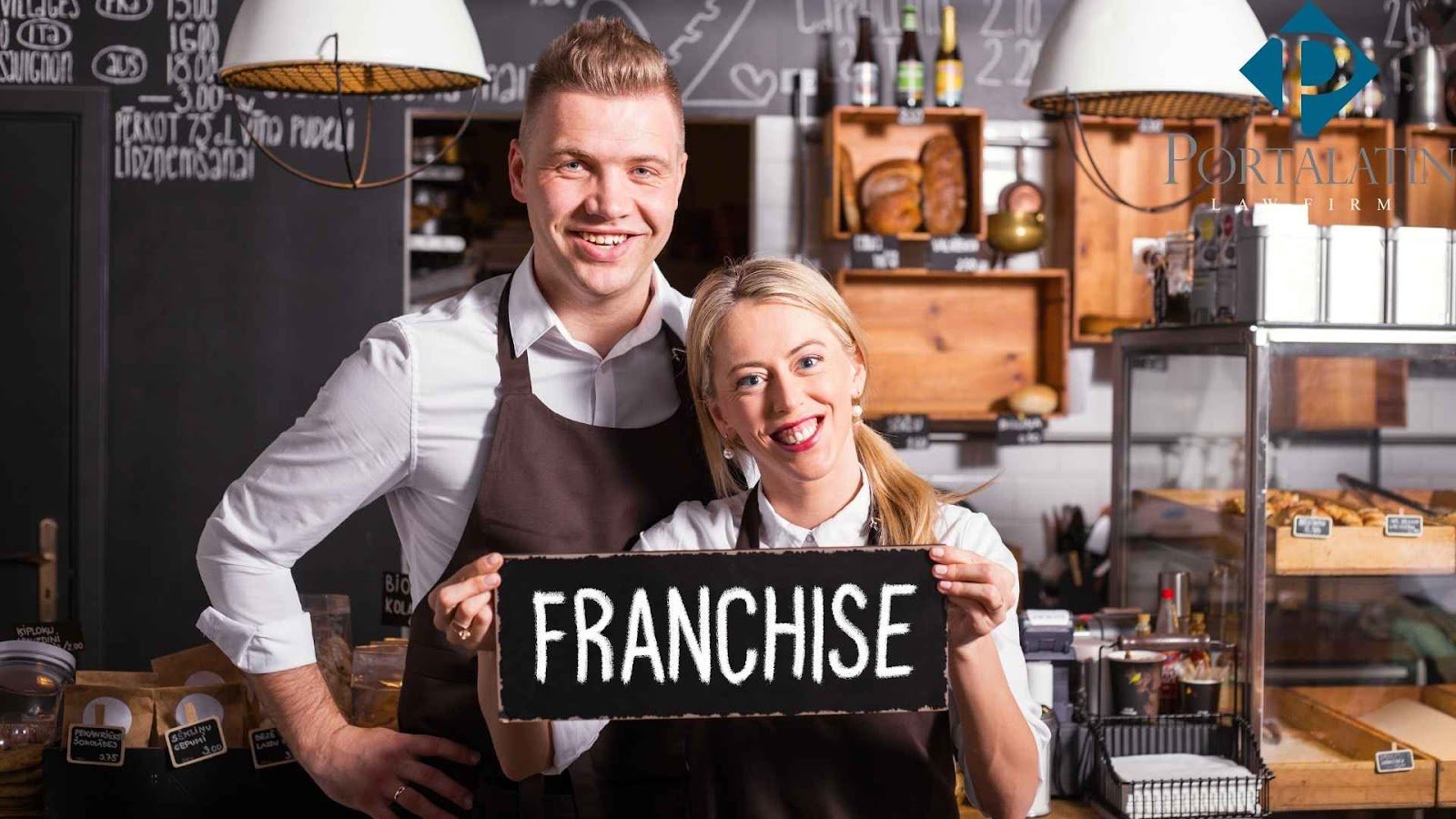 Smiling cafe owners holding franchise sign.