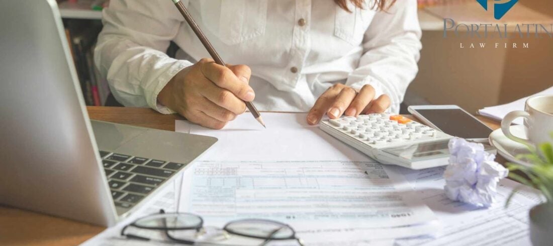 Person creating a business plan at law firm desk.
