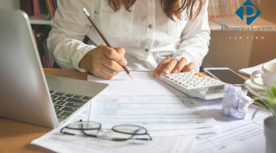 Person creating a business plan at law firm desk.