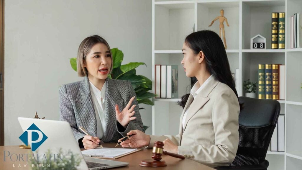 Two women discussing in law office.