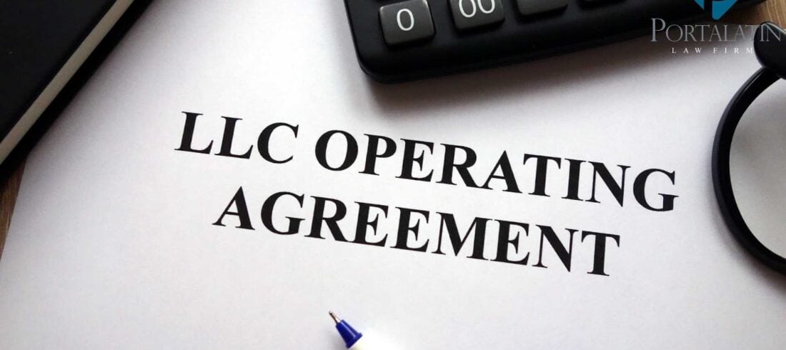LLC Operating Agreement document with calculator and pen