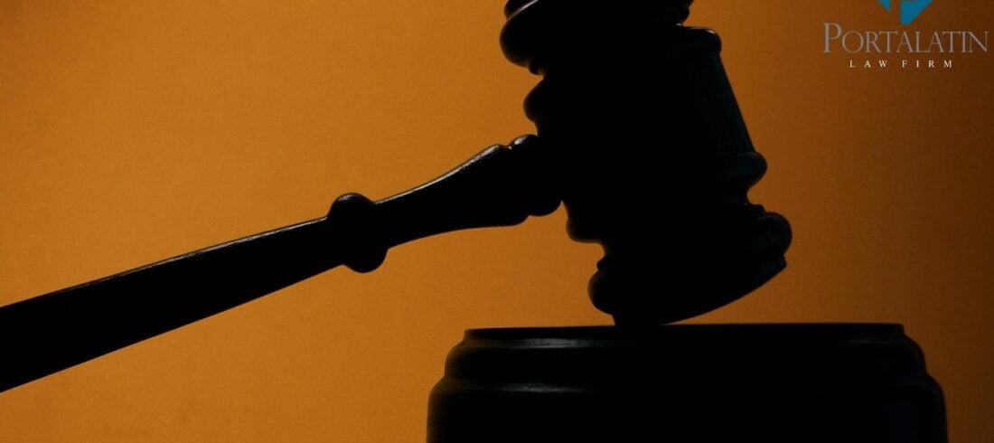 Judge's gavel silhouette on orange background