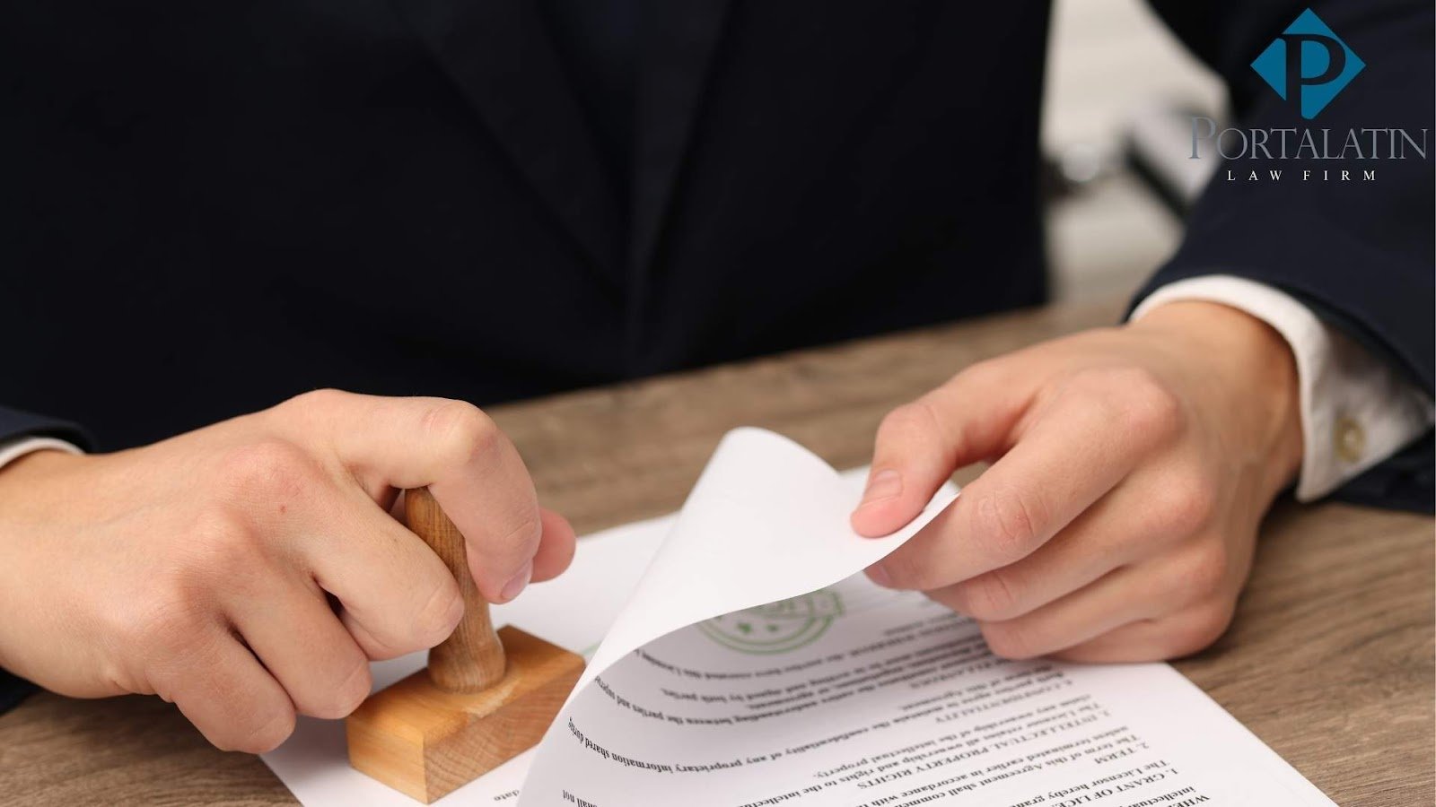 Lawyer stamping legal document at desk.