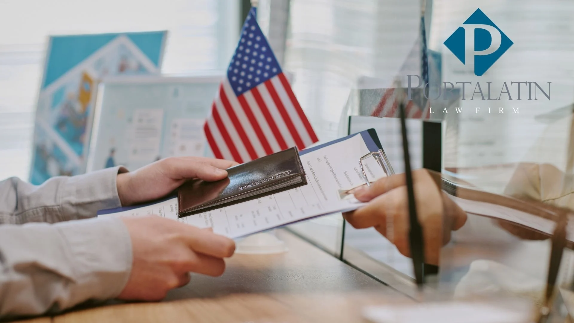 Person submitting passport and documents at office counter for E-2 Visa application