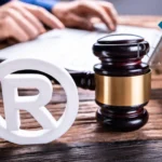 Gavel and registered trademark symbol on desk